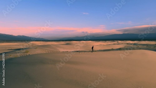Desert Dreams: Aerial Views of a Twilight Stroll Amid the Taton Dunes in Fiambalá, Catamarca, Argentina photo