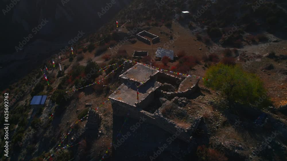Aerial circular view traditional stone building complex in Khangshar village. Annapurna circuit trek. Manang district in Nepal. Himalayas mountain range trekking and architecture. Aerial circular view traditional stone building complex in Khangshar village. Annapurna circuit trek. Manang district in Nepal. Himalayas mountain range trekking and architecture.