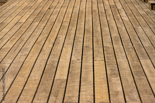 Wooden tree deck at a pier.