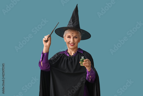 Mature witch with magic wan...