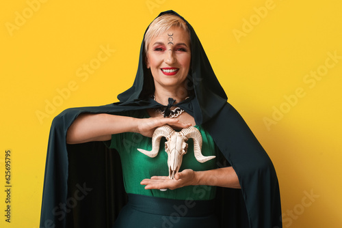 Mature witch with goat skul...