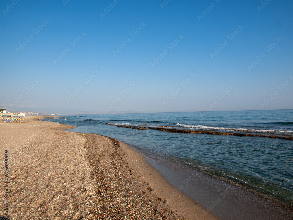 View of sandy beach in Rethymnon on Crete, Greece