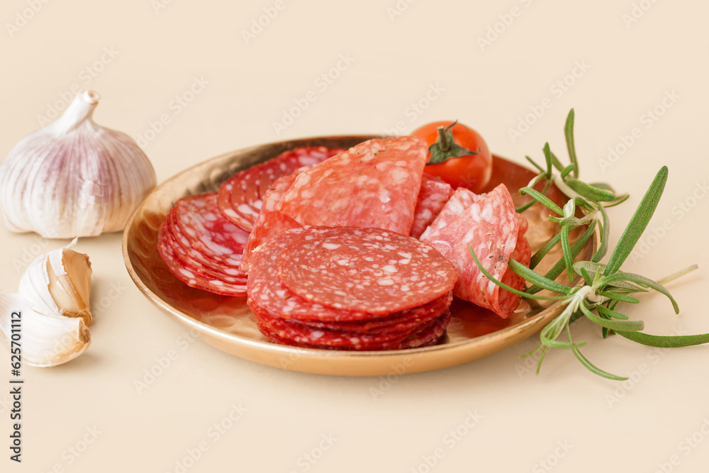 Plate with slices of tasty salami on yellow background Plate with slices of tasty salami on yellow background