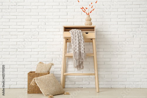 Table with cozy blanket and...