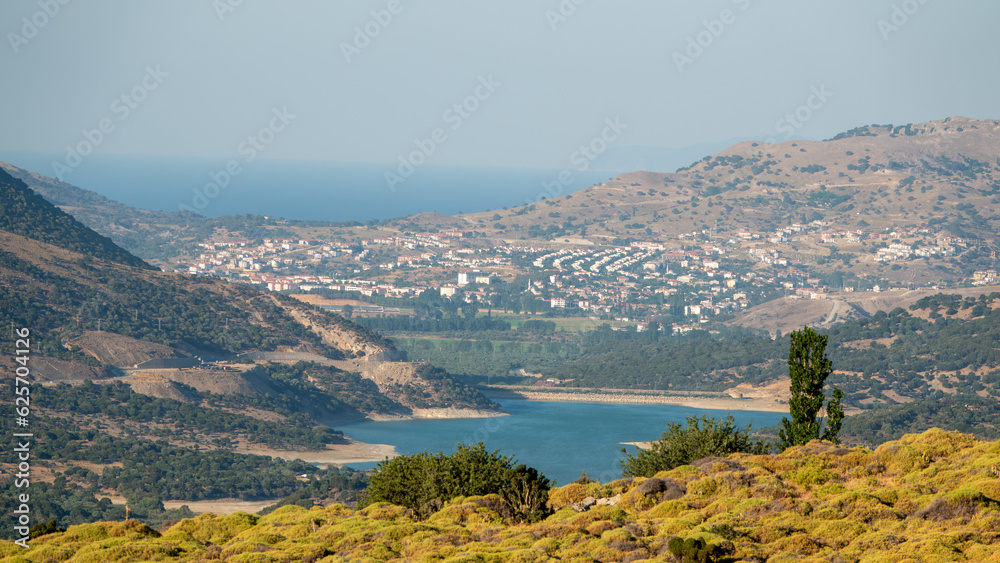 Tepekoy dam, central Gokceada, northern Aegean Sea and rural mountainous area view from Tepekoy slopes of Gokceada. Canakkale, Turkey Tepekoy dam, central Gokceada, northern Aegean Sea and rural mountainous area view from Tepekoy slopes of Gokceada. Canakkale, Turkey