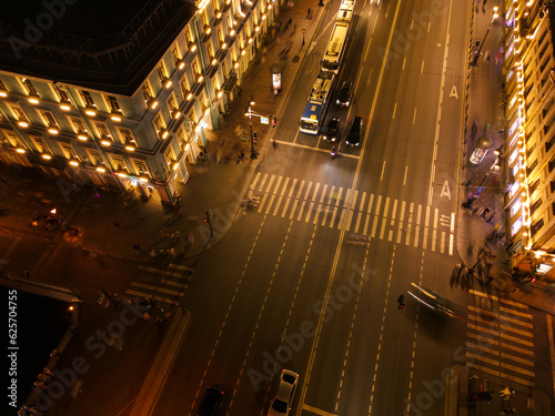 Aerial 80 view of the bright Nevski street and Kazan Cathedral and House of the Singer company in the historical city of St. Petersburg at summer midnight