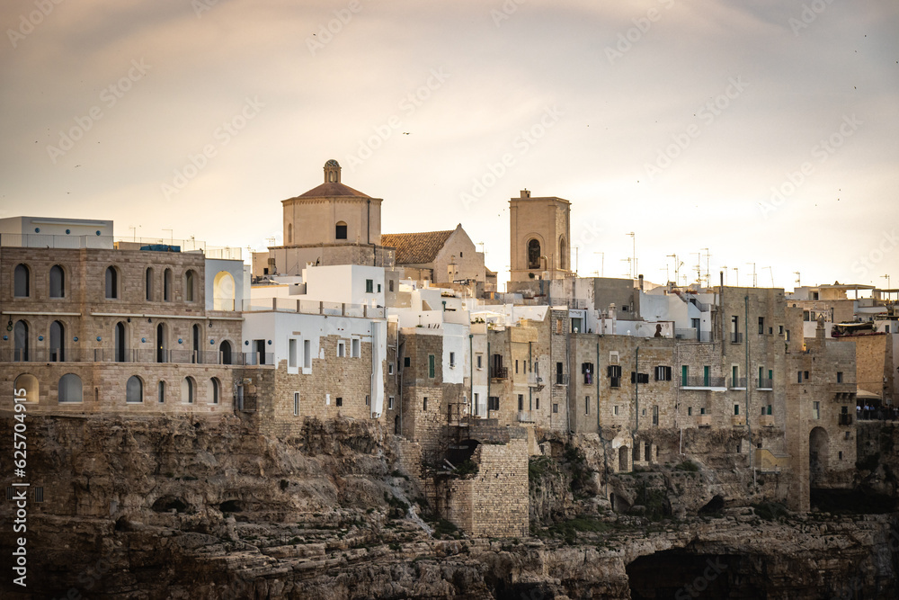 grottos, caves in polignano a mare, puglia, italy, europe, sunset, cliffs