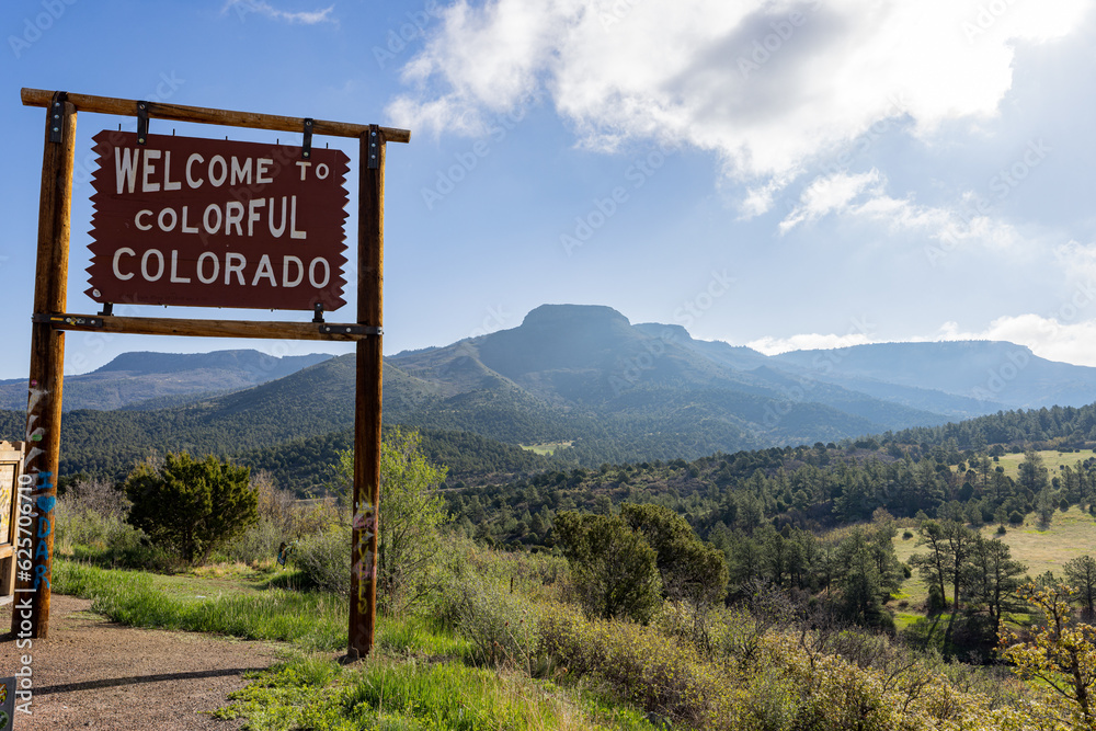 Sunny view of the Welcome to Colorful Colorado sign