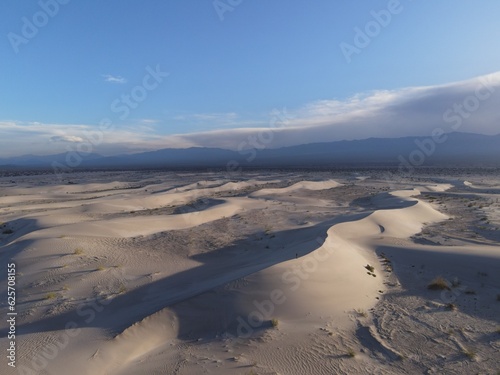 Desert Dreams: Aerial Views of a Twilight Stroll Amid the Taton Dunes in Fiambalá, Catamarca, Argentina photo