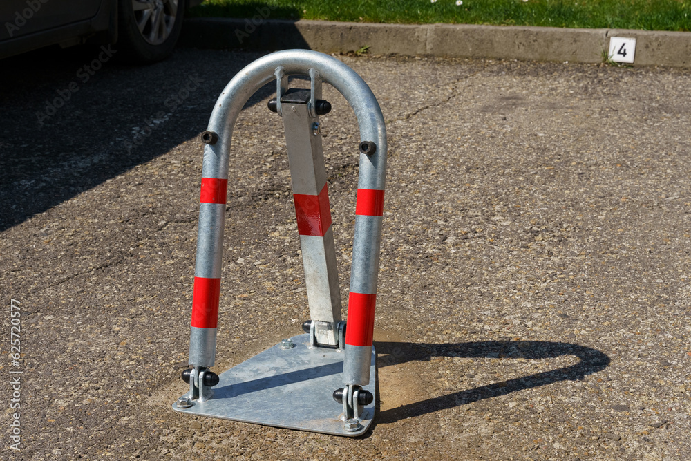 A device for reserving a parking space in a parking lot