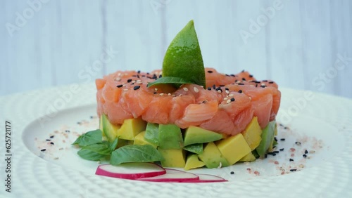 Salmon tartare with avocado, ceviche, rotates 360 degrees, close up