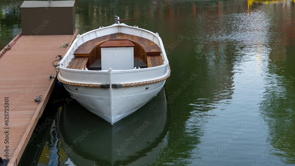 Old traditional fisherman boat in the canal in the Netherlands.