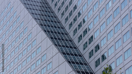 Exterior architecture of modern tall grey glass building