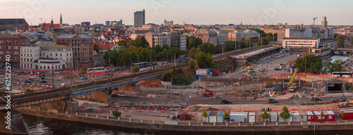 Building Rail Baltica project in the cenetr of Riga. Construction works of roads, railway and bridges in Riga.