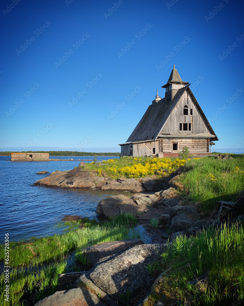 Church on the shore of the White Sea near Rabocheostrovsk, Russia, June 2019