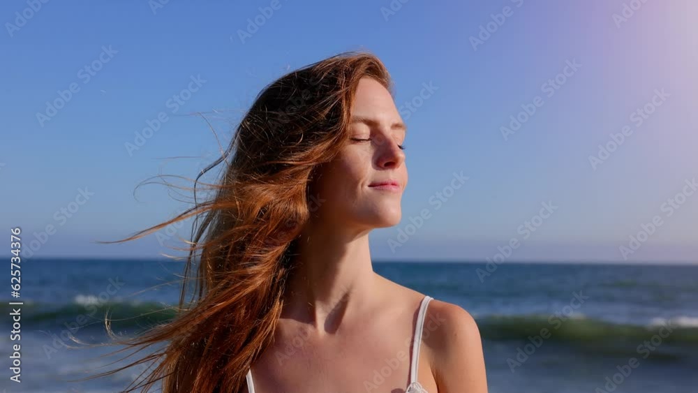 Portrait of an attractive woman at the beach at sunset. Slow Motion. Portrait of an attractive woman at the beach at sunset. Slow Motion.