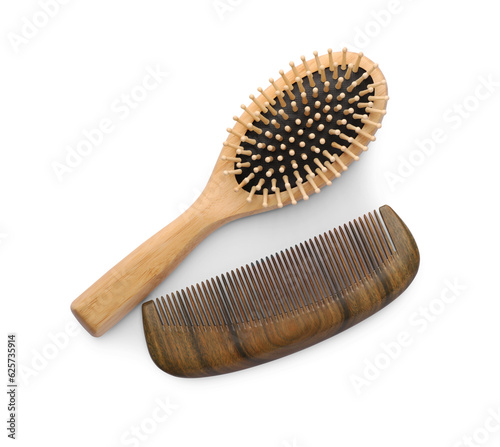 New wooden hair brush and comb on isolated white  top view