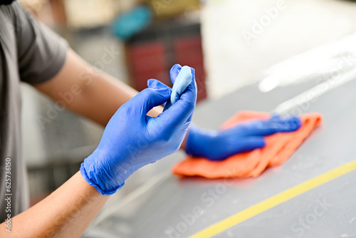 Man polishing car body