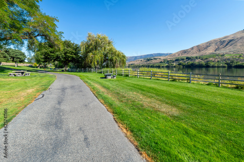 Fototapeta Naklejka Na Ścianę i Meble -  The scenic waterfront Kirby Billingsley Hydro Park along the Columbia River as it runs through East Wenatchee on Highway 28 in Chelan County, Washington State, USA.