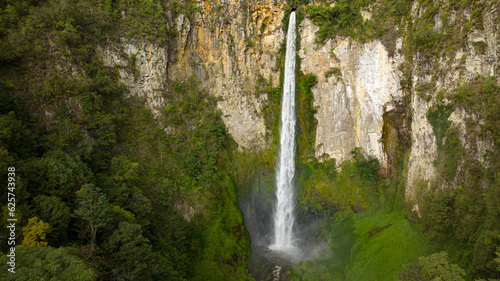 Waterfall in a tropical forest. Sipiso Piso falls. Sumatra  Indonesia.