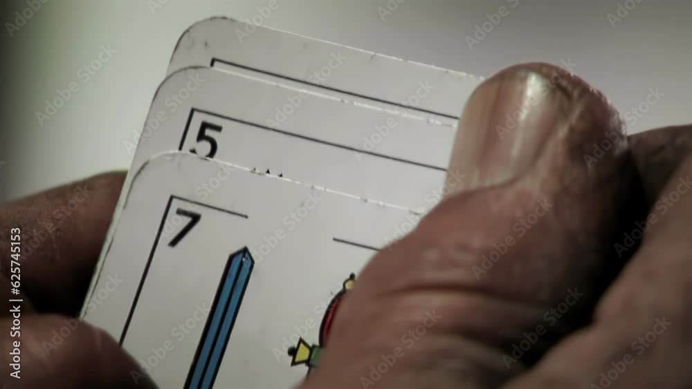 Man Hands Holding Three Truco Cards, Truco is a Trick-taking Card Game Popular in Argentina. Close Up. 4K Resolution.