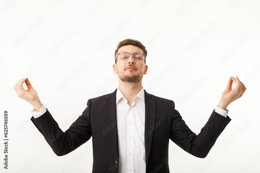 Businessman meditating with closed eyes isolated on white background. Businessman meditating with closed eyes isolated on white background.