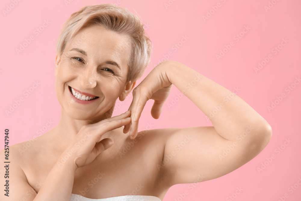 Happy mature woman on pink background, closeup Happy mature woman on pink background, closeup