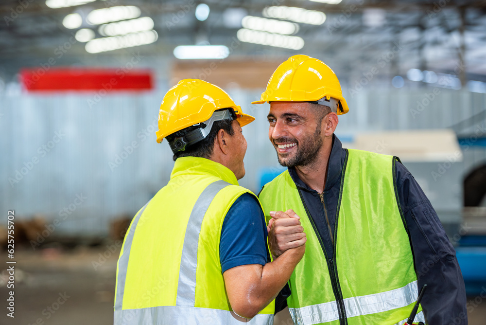 greeting by handshake touch fist and elbow of two engineer supervisor partnership in old factory. foreman greeting friend for good friendship colleague laborer in teamwork factory. greeting by handshake touch fist and elbow of two engineer supervisor partnership in old factory. foreman greeting friend for good friendship colleague laborer in teamwork factory.