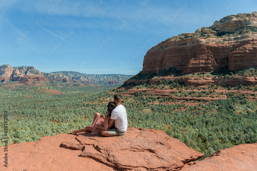 Travel in Devil's Bridge Trail, scenic view panoramic landscape in Sedona, Arizona, USA. Happy Couple on the famous trail in Sedona