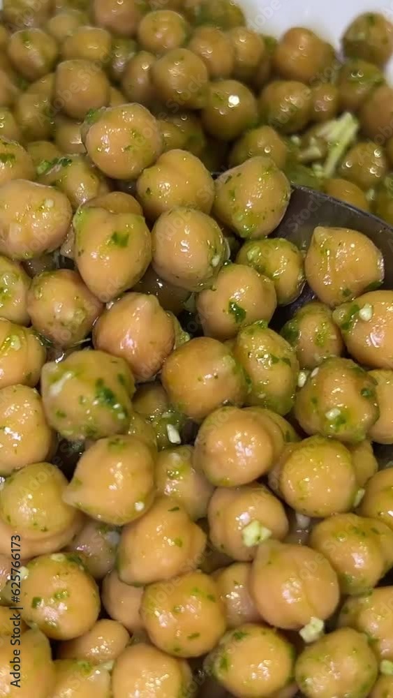 boiled chickpeas in a white plate pick up with spoon cook hummus healthy food nuts squirrels boiled chickpeas in a white plate pick up with spoon cook hummus healthy food nuts squirrels
