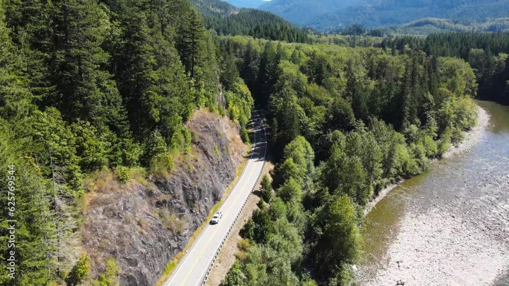 Mountain Loop Highway in Verlot, Washington. Follow the trail alongside the picturesque Stillaguamish River. Aerial drone flight captures the serenity and natural wonders of the landscape. Mountain Loop Highway in Verlot, Washington. Follow the trail alongside the picturesque Stillaguamish River. Aerial drone flight captures the serenity and natural wonders of the landscape.