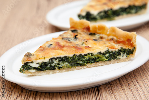 a piece of classic spinach quiche