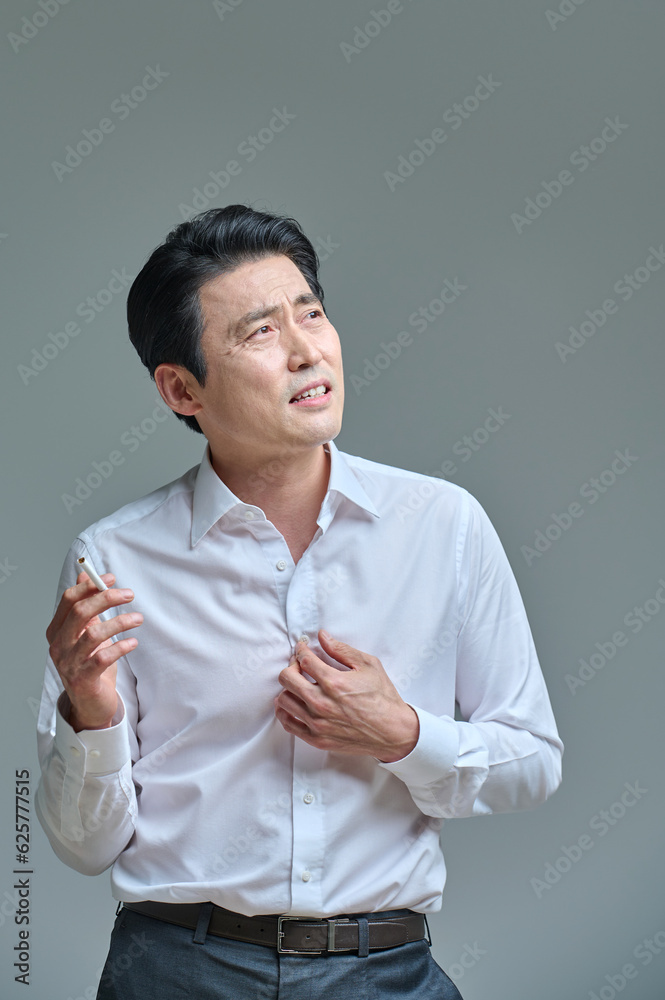 Middle-aged man struggling to quit smoking, smoking Middle-aged man struggling to quit smoking, smoking