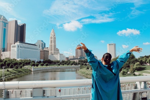 woman in front of columbus ohio city skyline photo