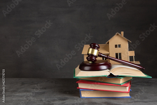 House model, gavel and books on the desk, Real property law concept, real estate auction