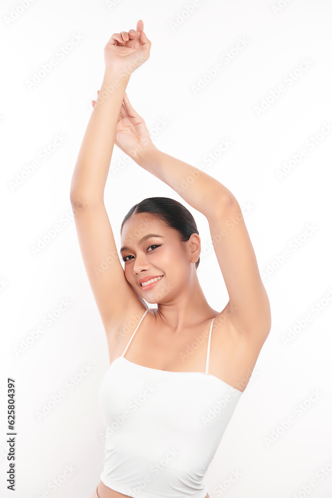 Beautiful Young Asian woman lifting hands up to show off clean and hygienic armpits or underarms on white background, Smooth armpit cleanliness and protection concept Beautiful Young Asian woman lifting hands up to show off clean and hygienic armpits or underarms on white background, Smooth armpit cleanliness and protection concept