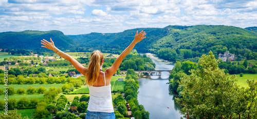 Obraz na plátně Rear view of woman enjoying panoramic view Dordogne river- France