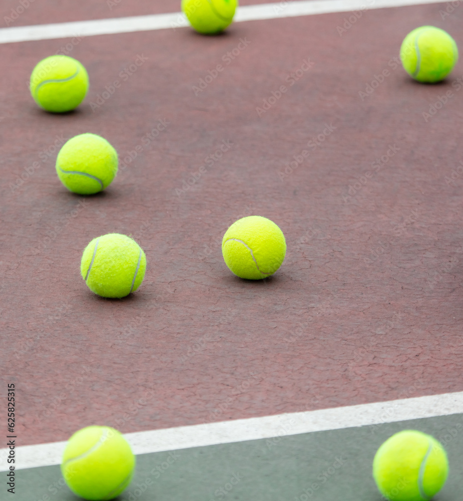 Yellow balls on the tennis court. Sport