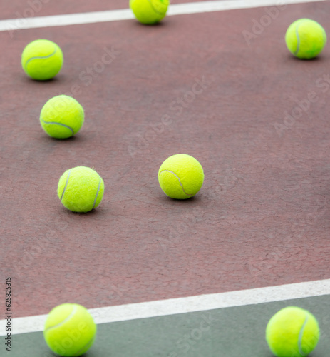 Yellow balls on the tennis court. Sport © schankz