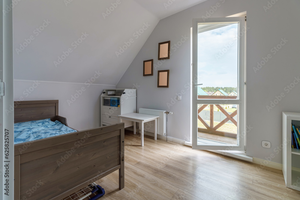 Fototapeta premium Modern bedroom in a new house in bright colors with a minimum amount of furniture