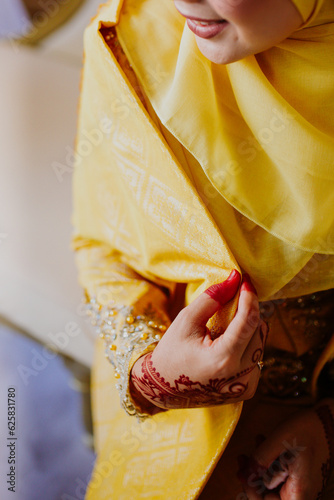 Beautiful bride with henna tattoo on her hands, closeup