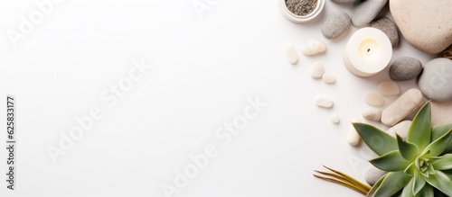 Photo of a minimalist table display with rocks and candles with copy space