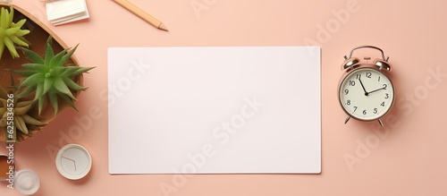 Photo of a desk with an alarm clock, a cup of coffee, and a notepad for a productive morning routine with copy space