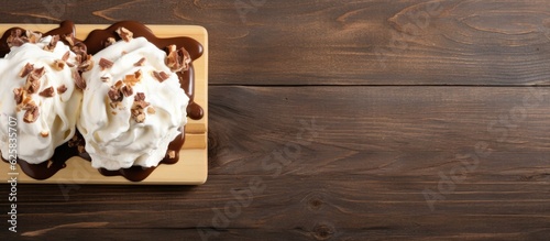 Photo of two delicious desserts with fluffy whipped cream on a wooden tray with copy space
