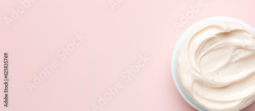 Photo of a bowl of yogurt on a vibrant pink background with ample copy space with copy space photo