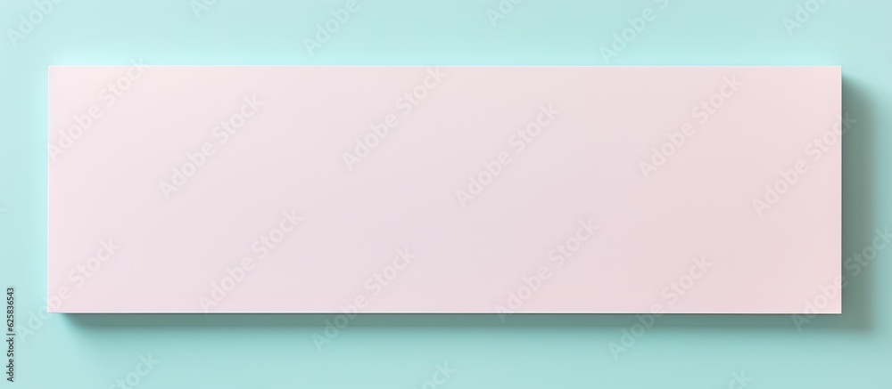 Photo of a pink square piece of paper on a blue background with copy space with copy space Photo of a pink square piece of paper on a blue background with copy space with copy space