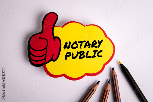 NOTARY PUBLIC. Sticky note with text on a white office table photo