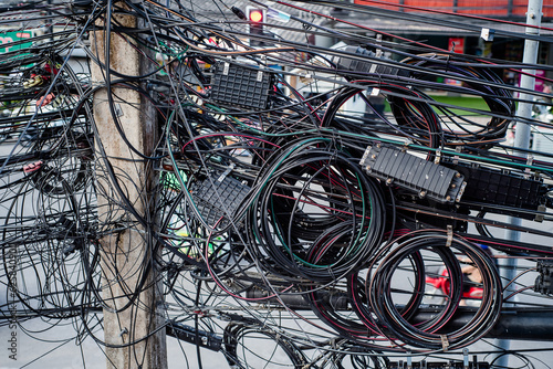 Untidy and cluttered wires and cables are installed.