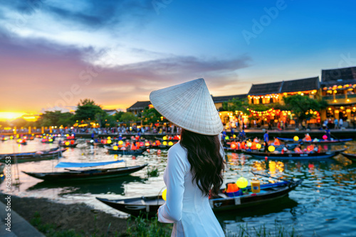 Asian woman wearing vietnam culture traditional at Hoi An ancient town,Hoi an city in Vietnam. photo