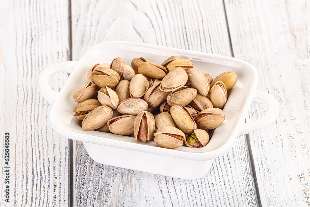 Salted tasty pistachio nuts heap Salted tasty pistachio nuts heap